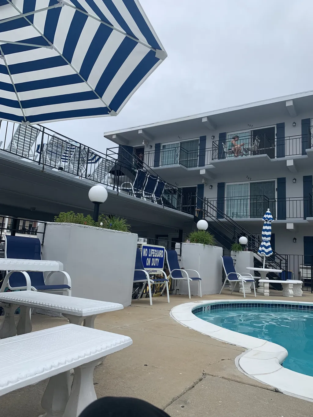 Plenty of pool chairs and tables to eat at around pool