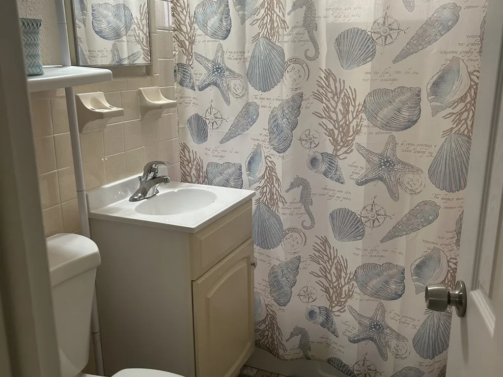 First bathroom full tub and removable hand held shower head