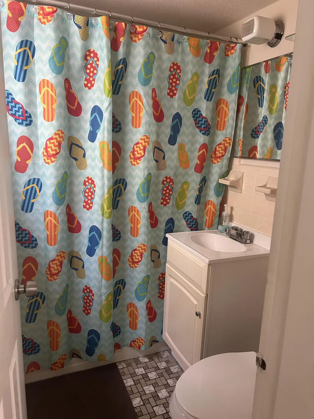 Second bathroom, full tub and removable shower head for hand held use 