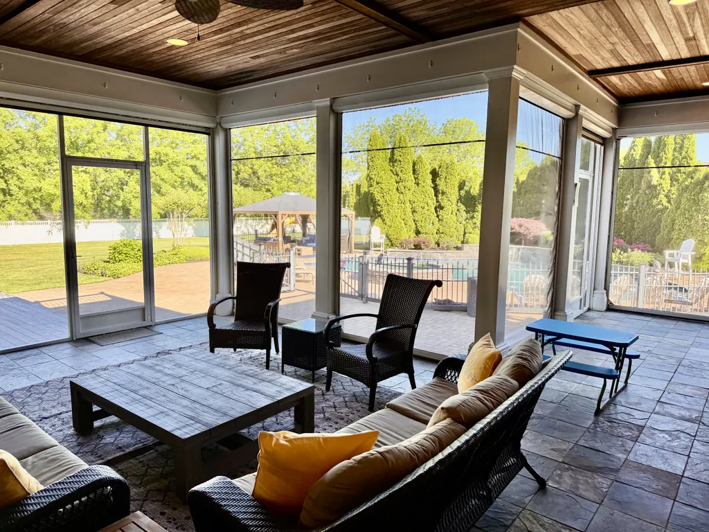 Screened Living Area with Views of Backyard