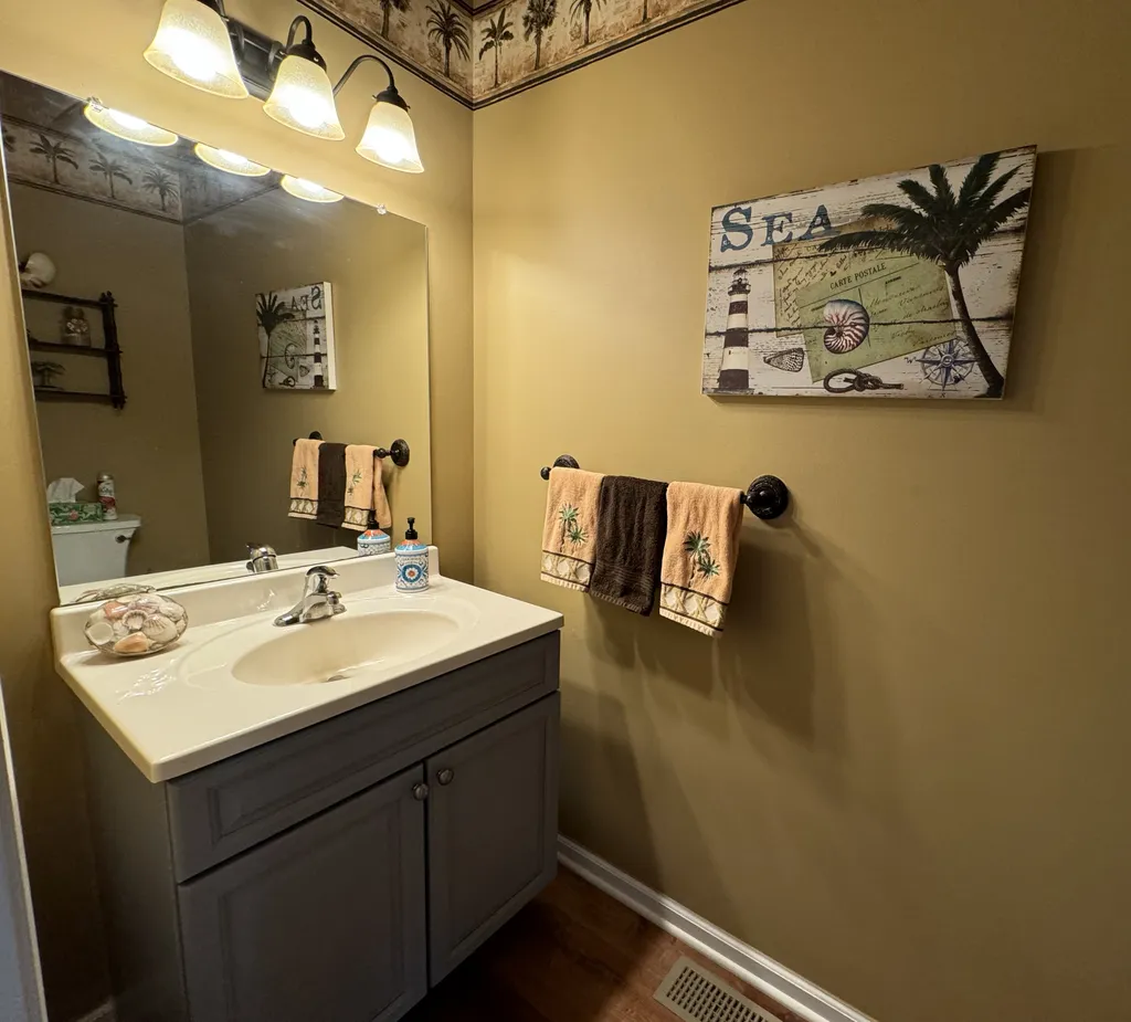 Powder Room next to kitchen with Palm Tree motif.
