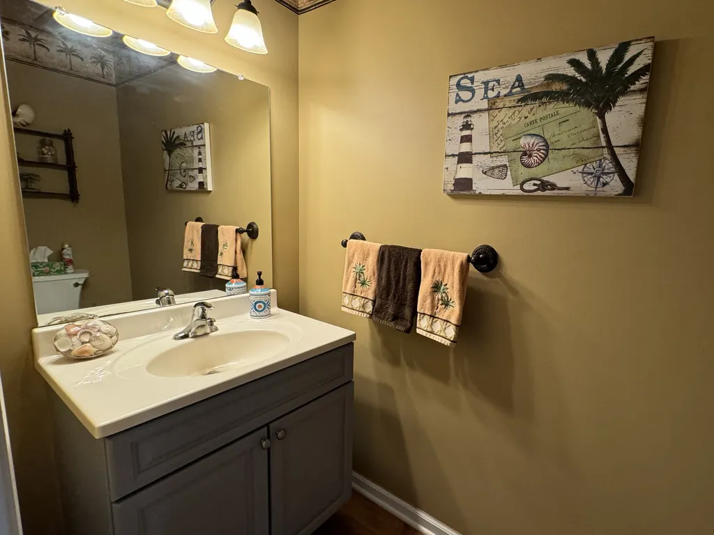 Powder Room next to kitchen with Palm Tree motif.