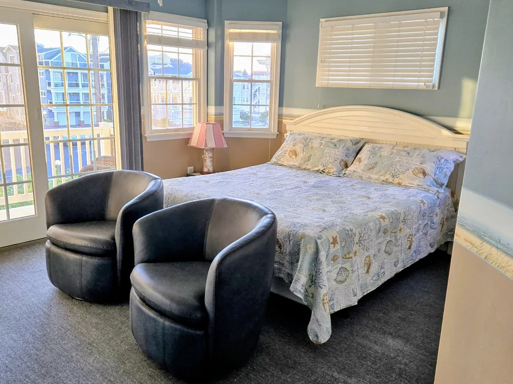2nd floor king bedroom with 2 swivel chairs