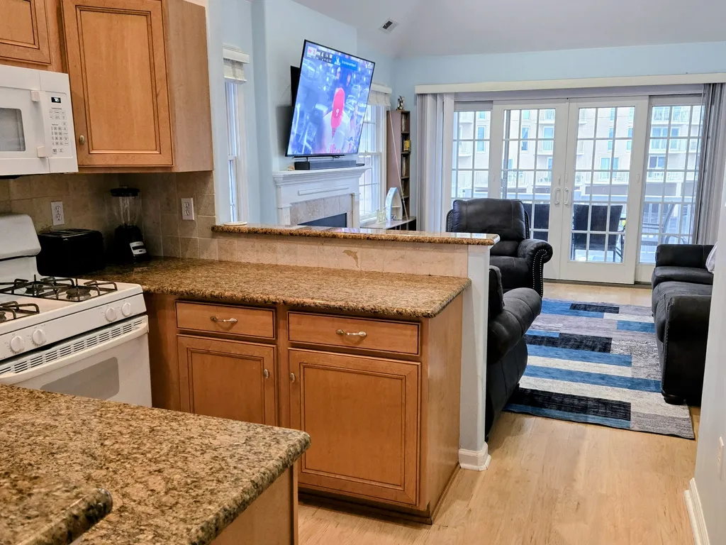 View of kitchen with Living Room in background