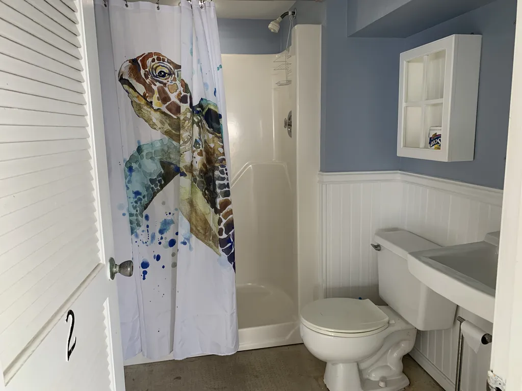 Full bathroom at Ground Level - for ease of access from the beach or on your way out.
