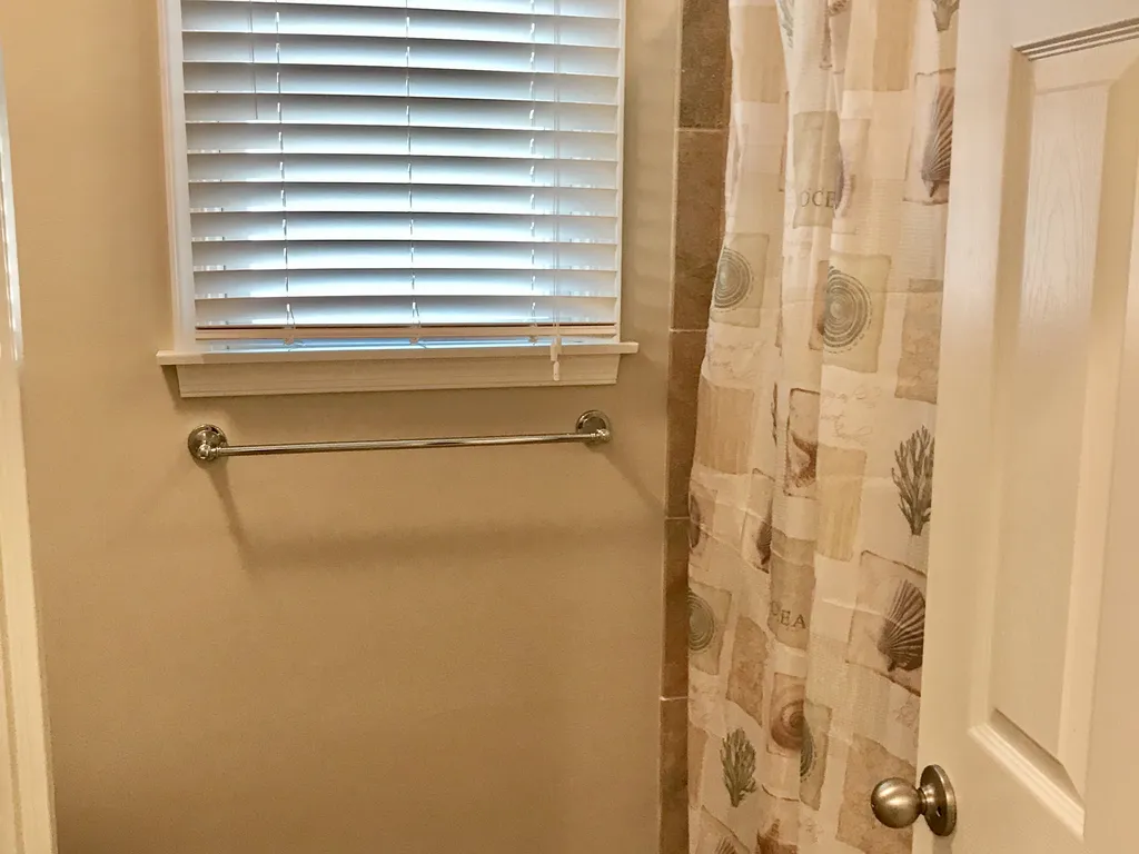 Main Bathroom with Quartz Counters and Tile Floor