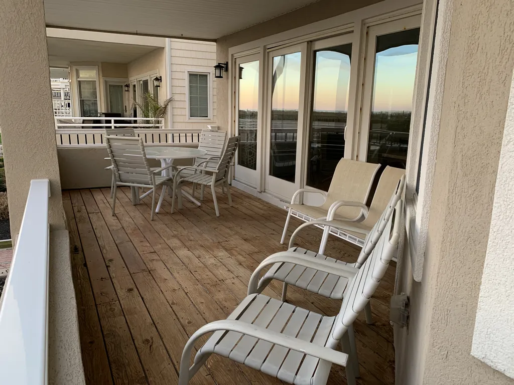 Front Deck with Beautiful Ocean Views - Check Out the Beautiful Reflection in the Sliding Glass Doors.