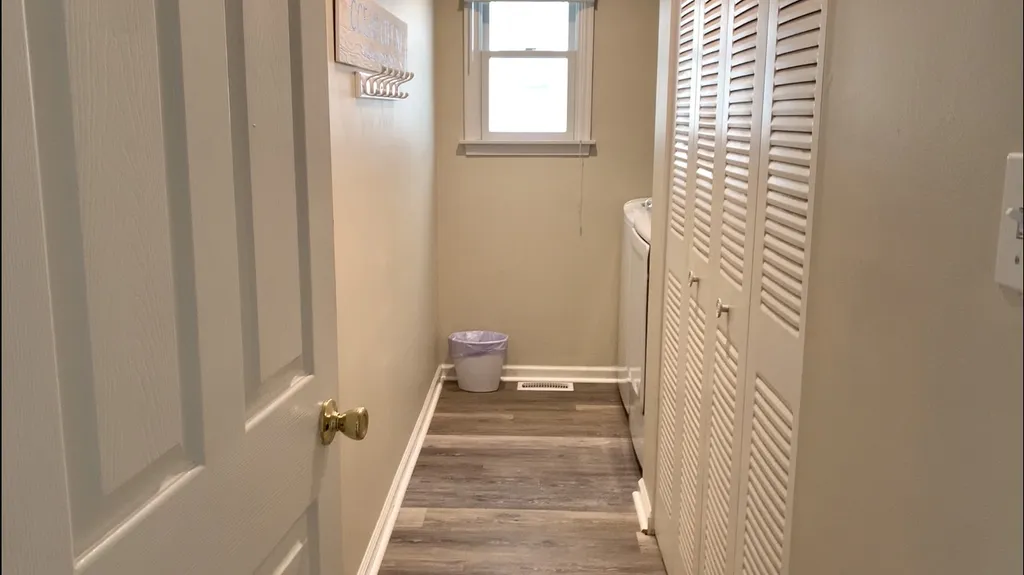 Laundry Room with Full-Size Washer &amp;amp; Dryer, plus coat hooks