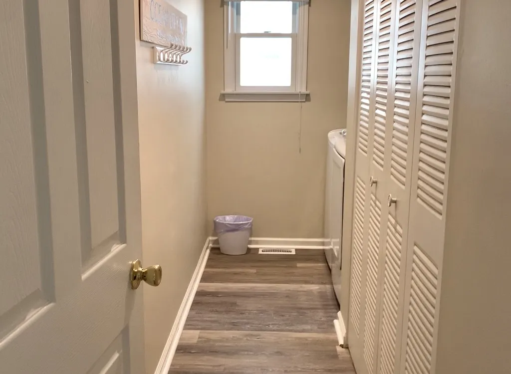 Laundry Room with Full-Size Washer &amp;amp; Dryer, plus coat hooks
