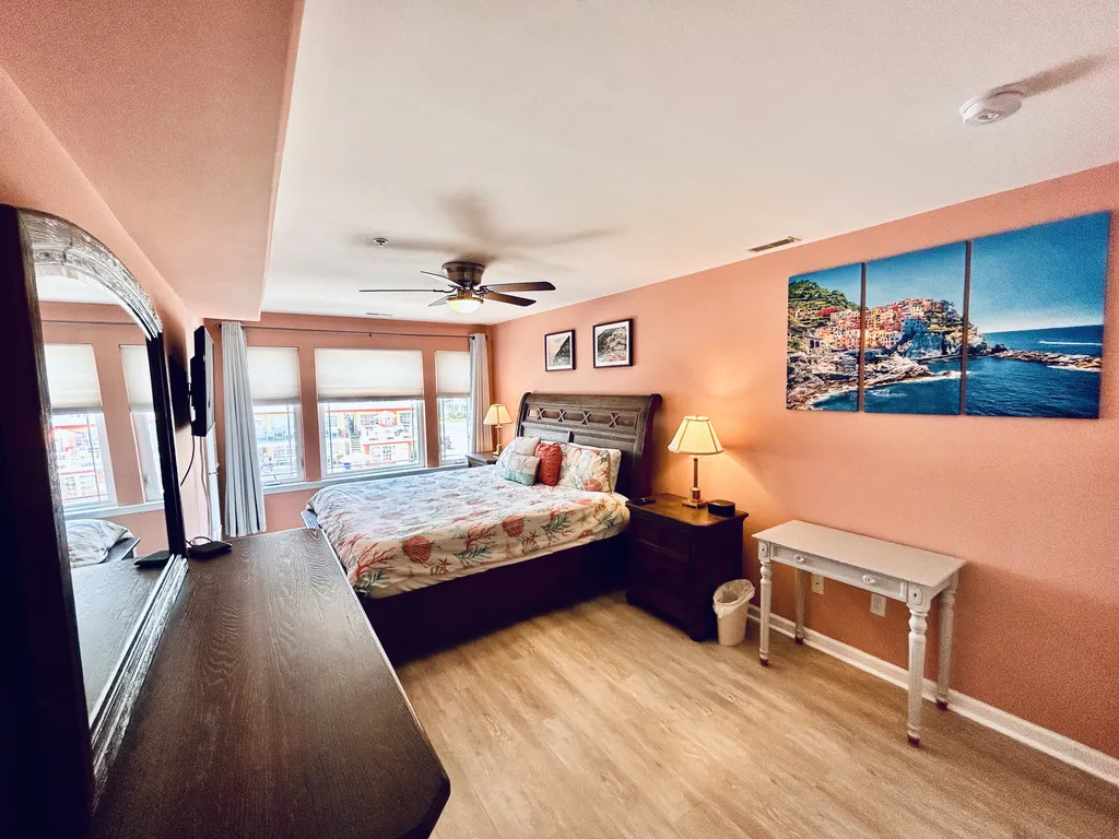 with mounted TV and private entrance to the balcony