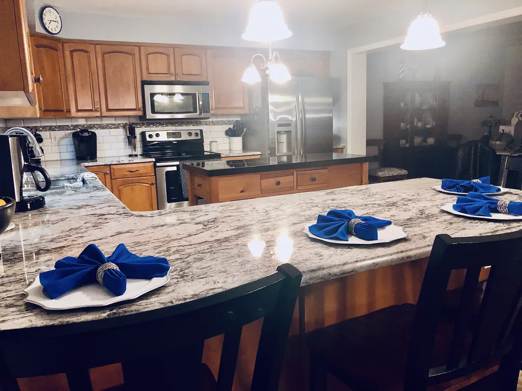 Granite kitchen with stainless appliances