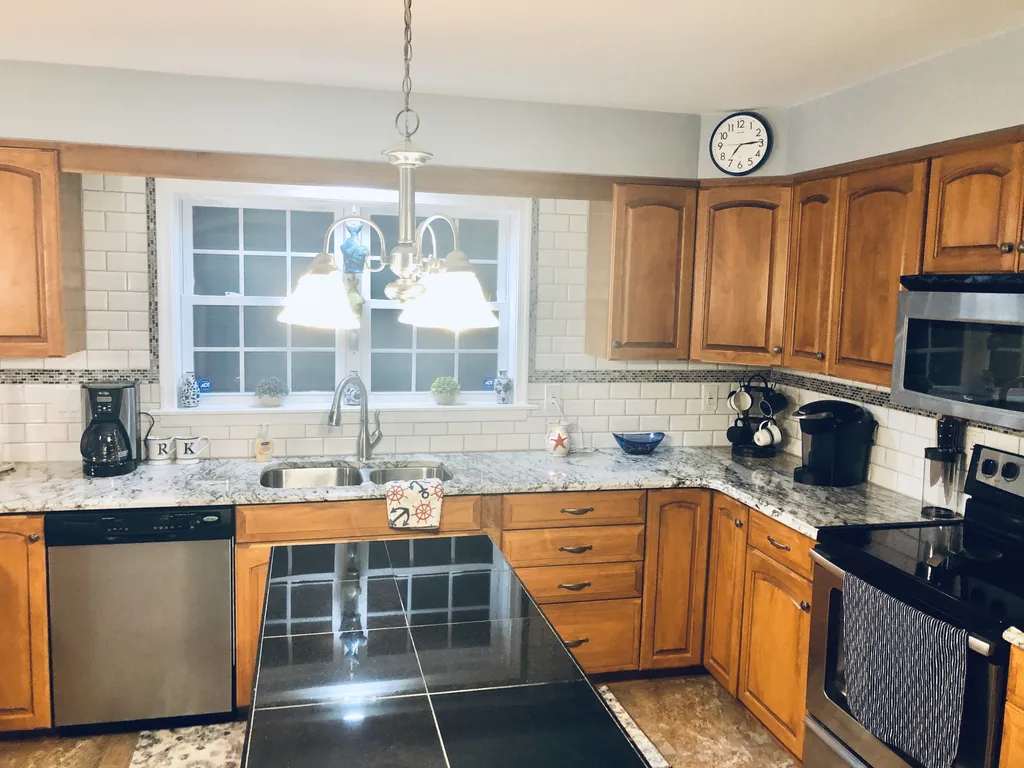 Center island that adds more worktop space to an already massive kitchen.