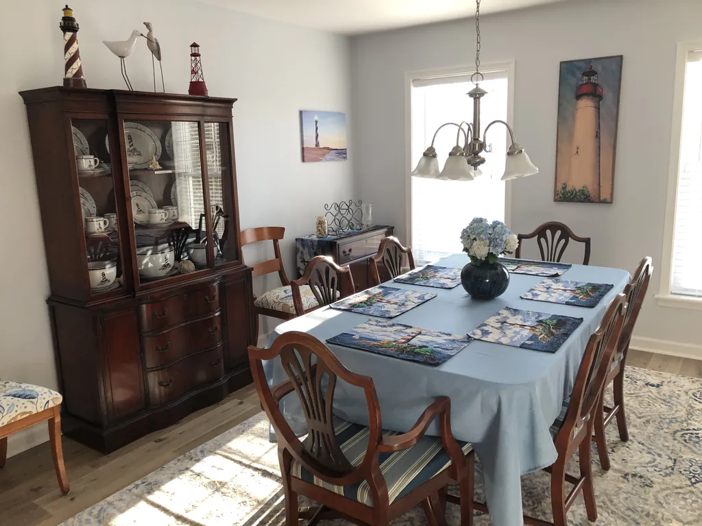 Nautical themed formal dining room that seats up to 8 people.