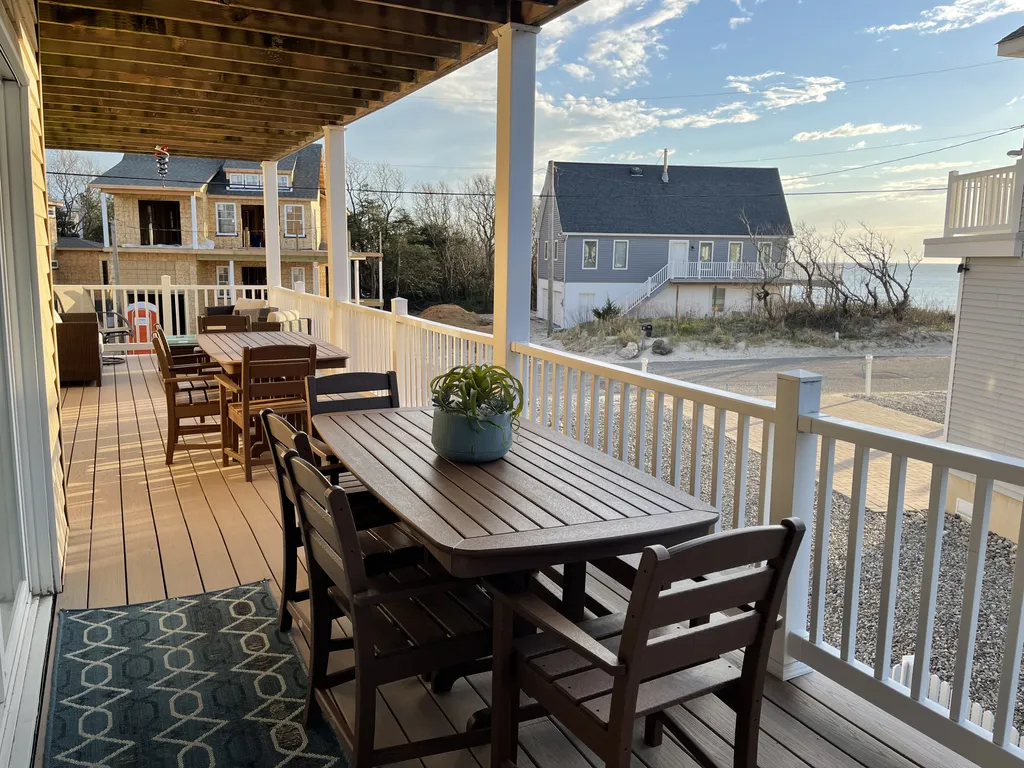 Dining deck with great bay views and lounge area