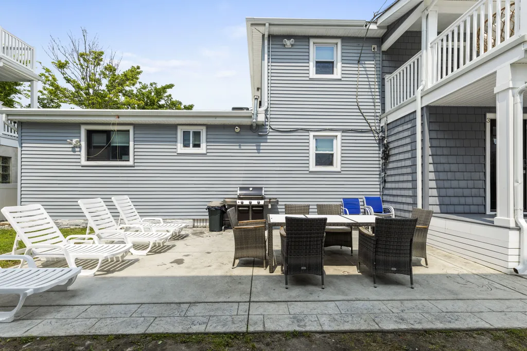 Backyard with grill and outdoor dining set