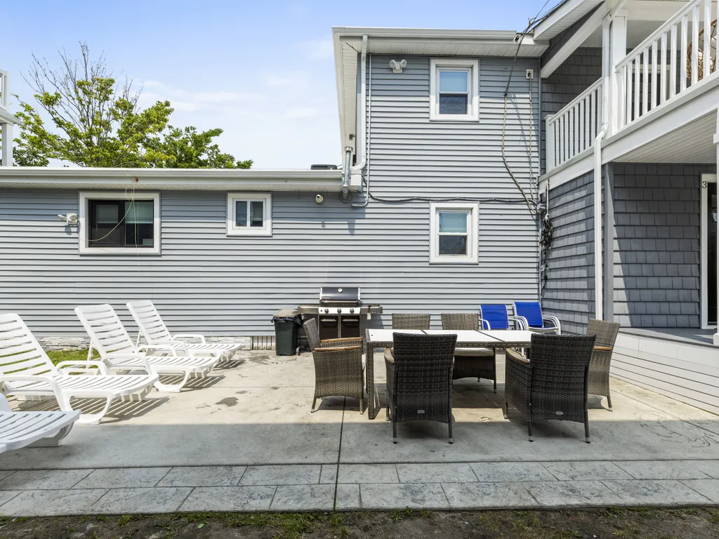 Backyard with grill and outdoor dining set