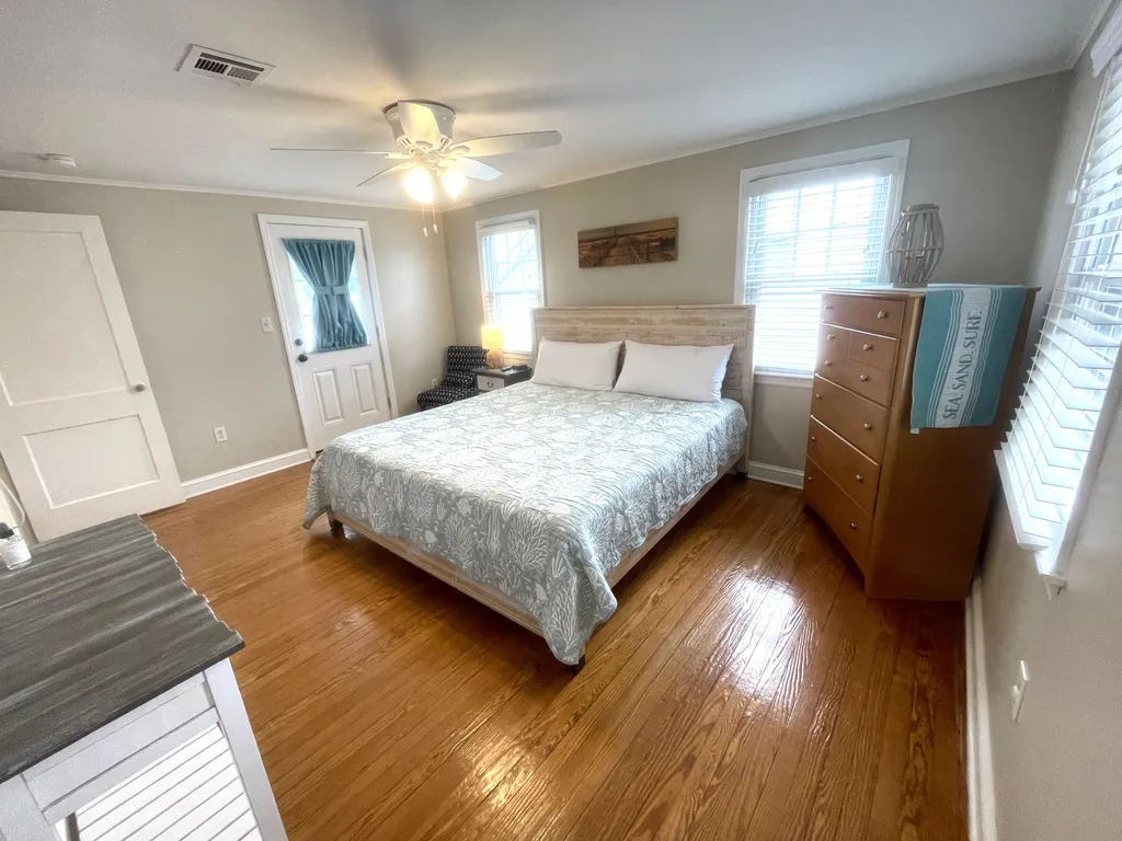 Spacious primary bedroom with Smart TV Door leads out to the balcony