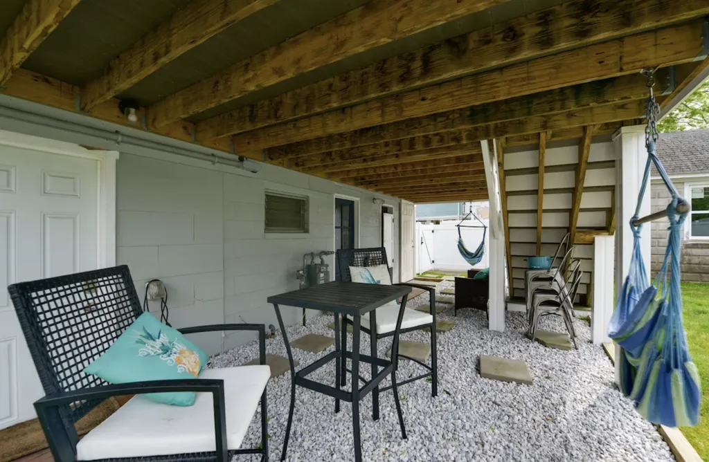 Underneath the back deck, you'll find additional seating, as well as lawn games and the outdoor shower