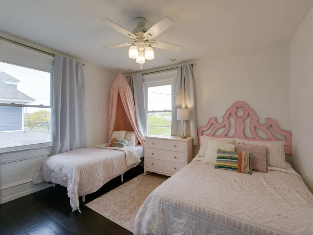 The Pink Room features a full bed, and a twin bed