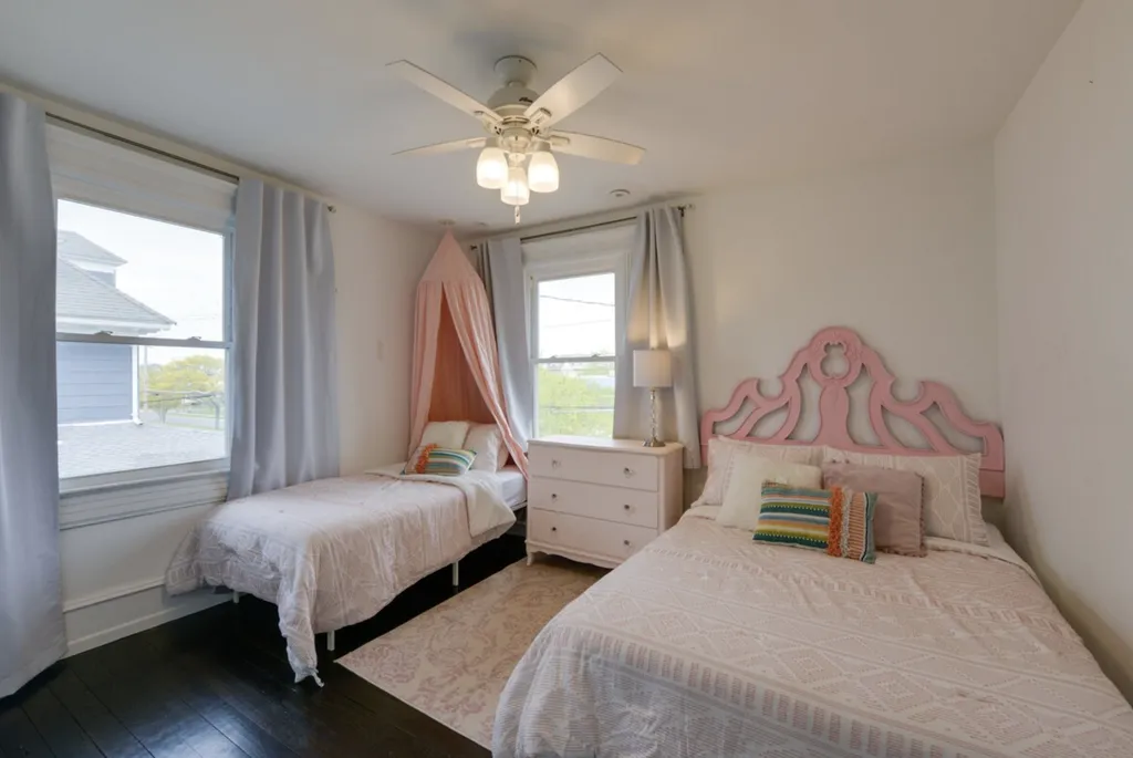 The Pink Room features a full bed, and a twin bed