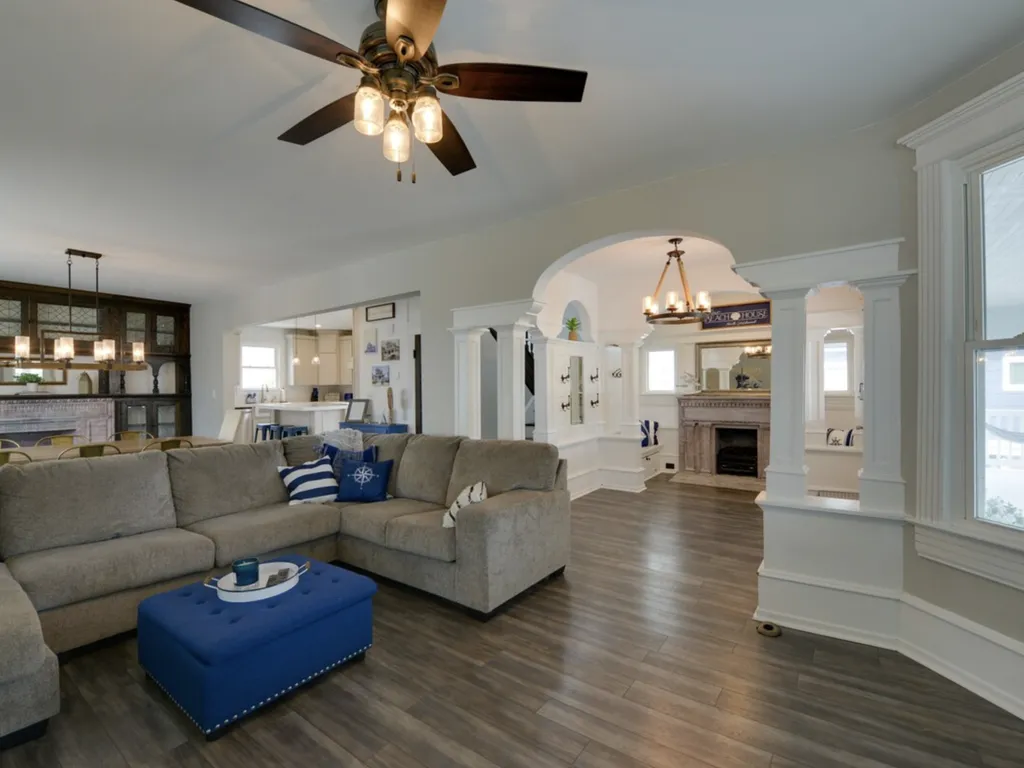 As you enter the house, you'll find a great room that includes a beautiful foyer with original woodwork, a large living room, and a dining room