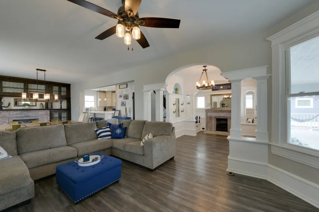 As you enter the house, you'll find a great room that includes a beautiful foyer with original woodwork, a large living room, and a dining room