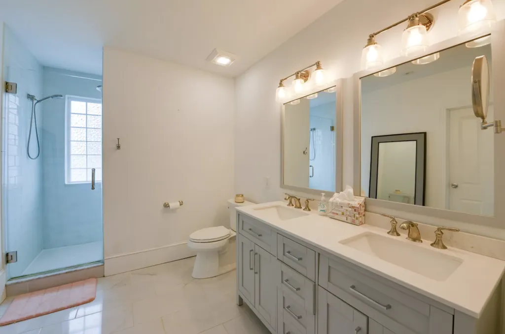 The Primary bathroom features double sinks, a large walk-in shower with dual shower heads, and an expansive walk-in closet