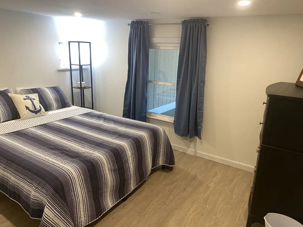 The apartment's second bedroom has a queen bed and a smart TV (not pictured)