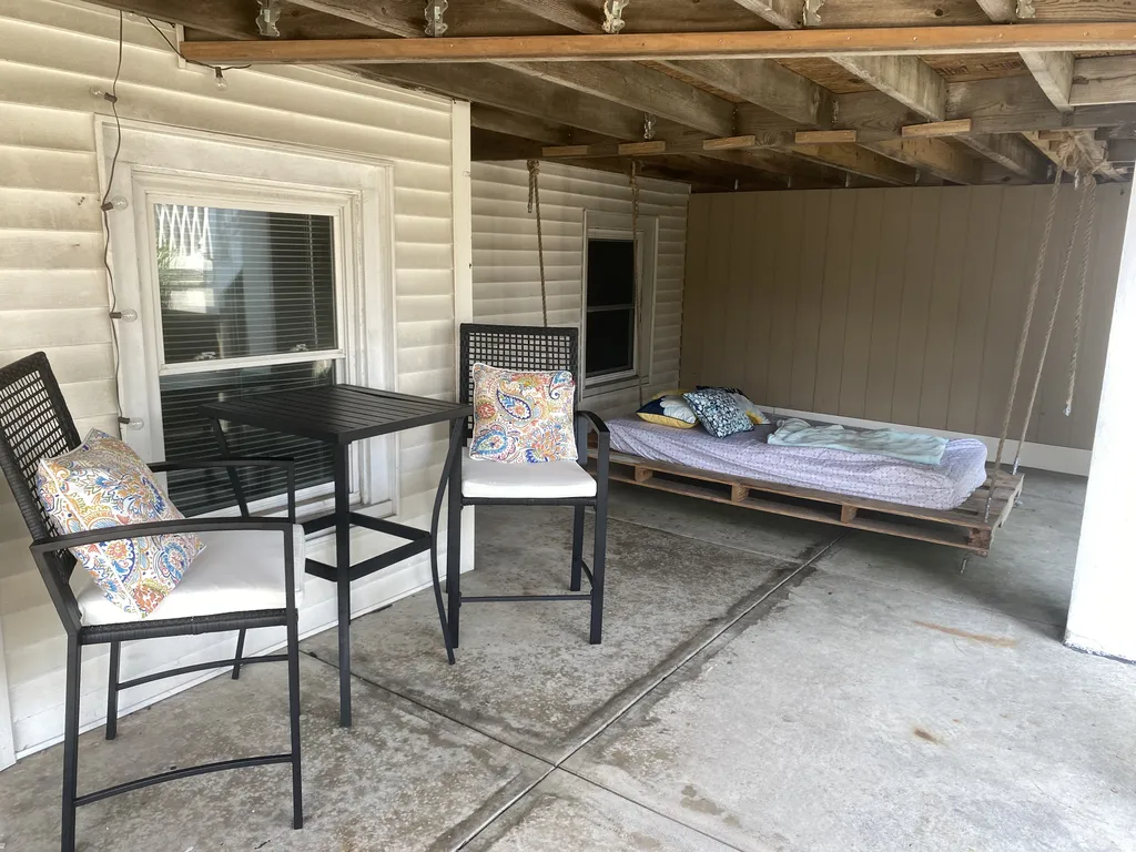 On the patio outside you'll find a bistro table for 2, as well as a comfy swing bed for those afternoon naps al fresco