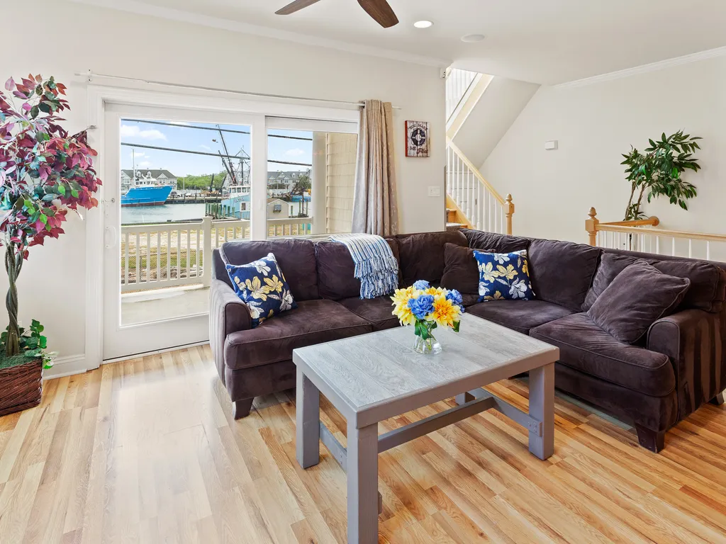 ❤️ Enjoy the fun living room area! A Great Place for you to gather with friends and family! Enjoy water views and the fresh sea air from the Large Outside Deck! A 65&amp;rdquo; 4K TV with Free HBO, Sports Channels, and lots of channels are available!
