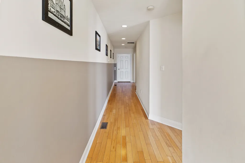 ❤️ The hallway starts at the Elevator and takes you to both Master Bedrooms and to a beautiful staircase on the other side with a unique chandelier and great water views! You will love it!