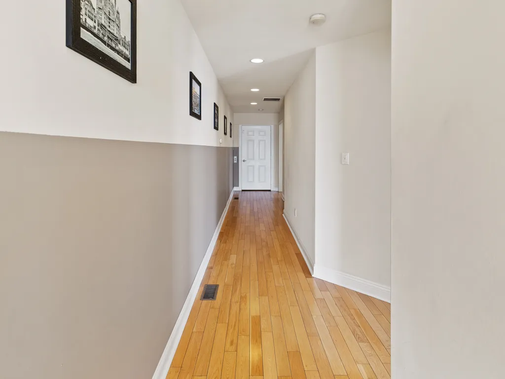 ❤️ The hallway starts at the Elevator and takes you to both Master Bedrooms and to a beautiful staircase on the other side with a unique chandelier and great water views! You will love it!