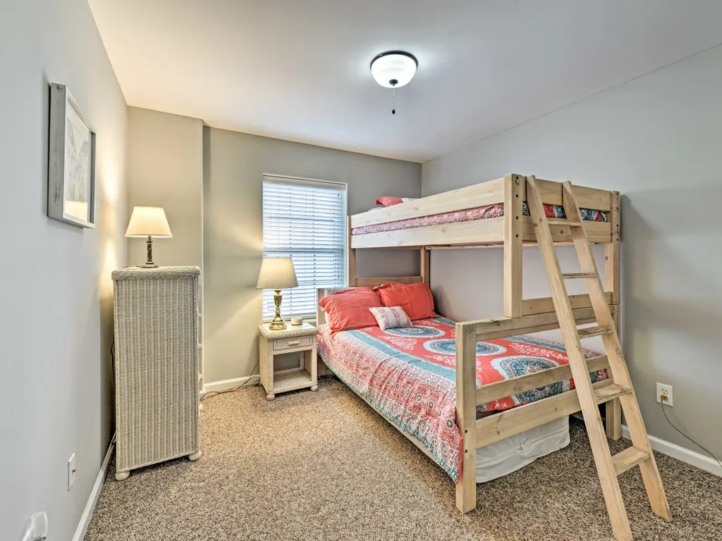 4th bedroom with twin over full bunk and extra mattress under bed