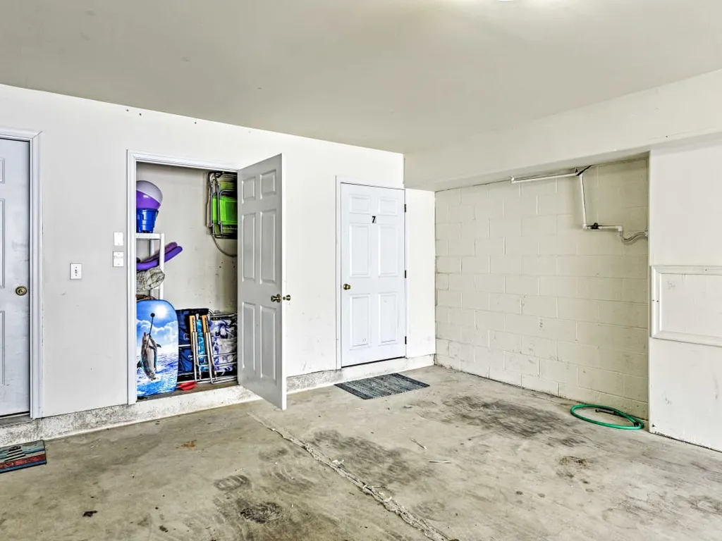 Beach closet with chairs, umbrella and toys