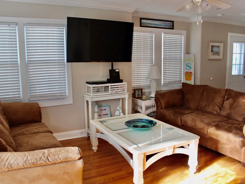 Bright spacious living room with lots of windows which allow natural light into the home
