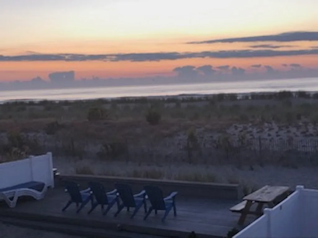 Sunrise from outside common area to include propane grills and outside shower