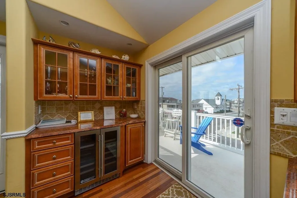 Kitchen with additional storeage/counter top area to private deck
