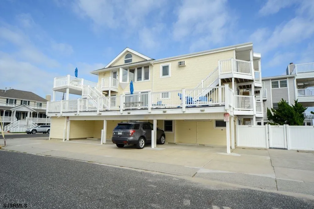View of building from the street (3C with peaked roof and private deck)