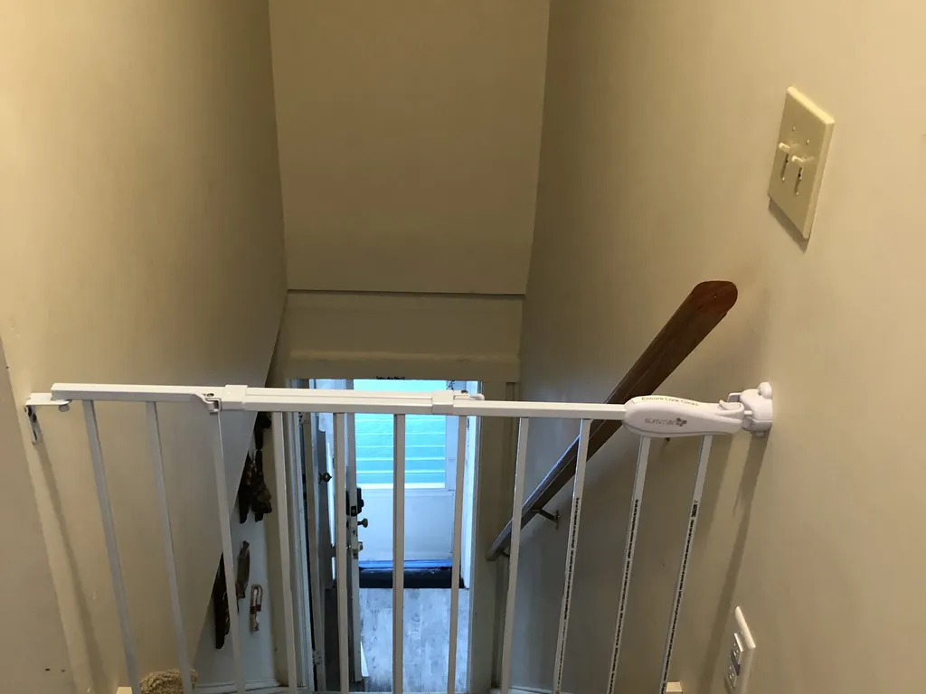 Baby gate in upstairs rec room