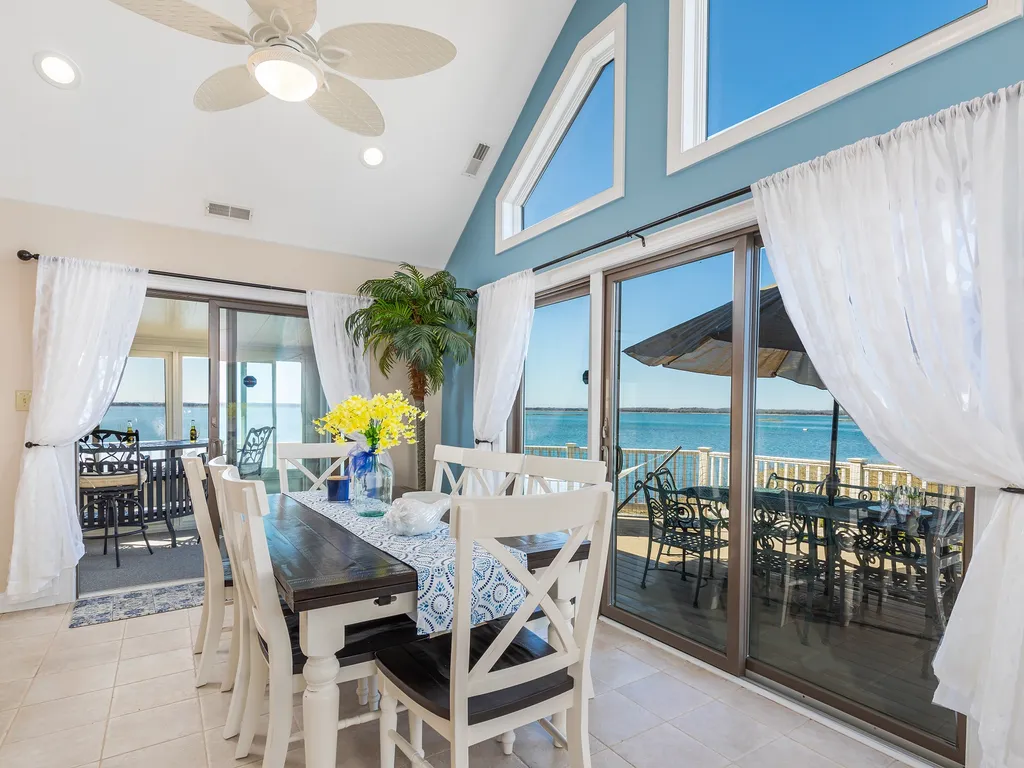 Kitchen Table overlooking deck and sunroom