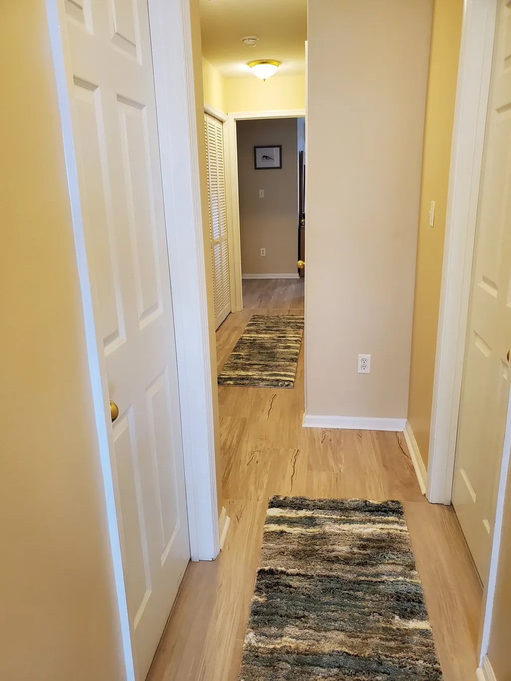 Hallway with new flooring throughout