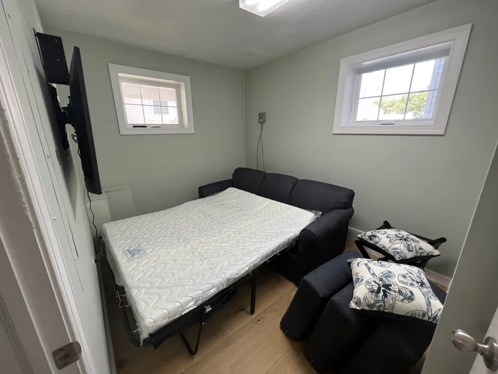 Ground level extra room with Queen sleeper sofa. Has central air, but note no bathroom on this level.