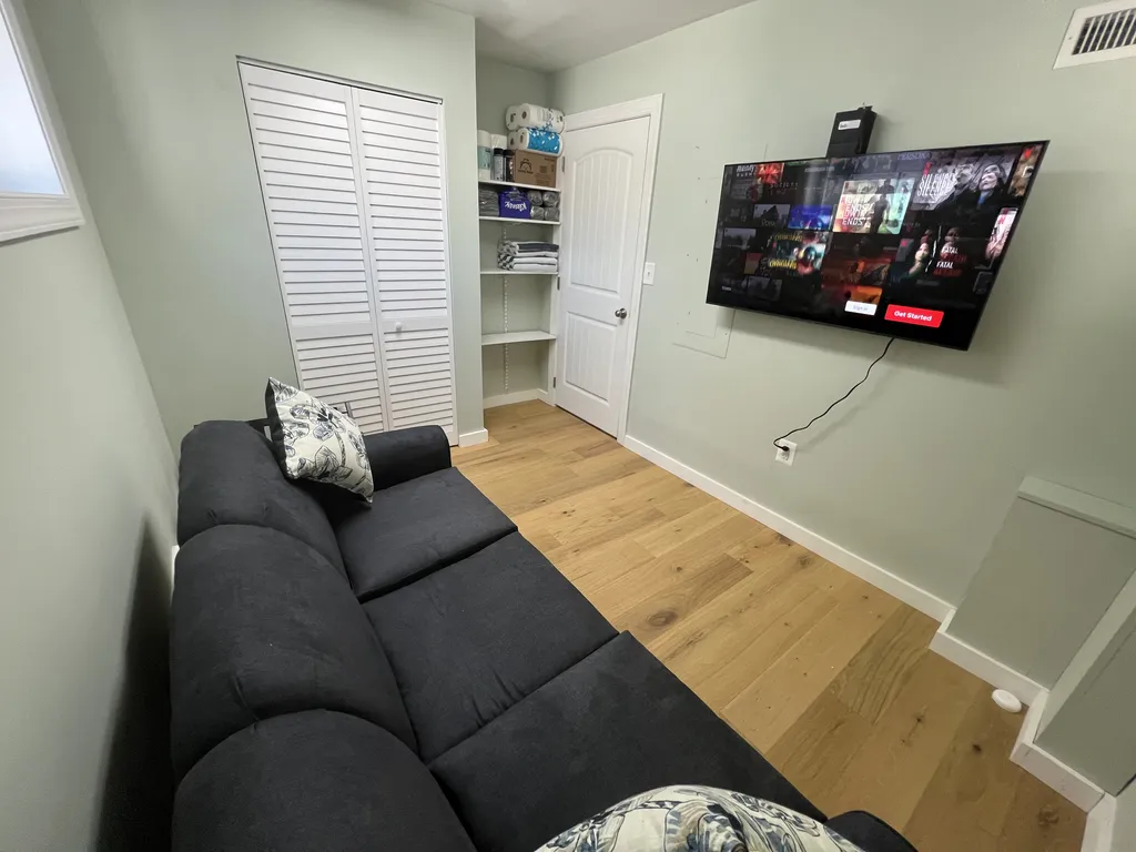 Ground level room with Queen sleeper sofa. Has central air. Note-no bathroom on this level and closet is actually mechanicals for the elevator-not for clothing.storage..
