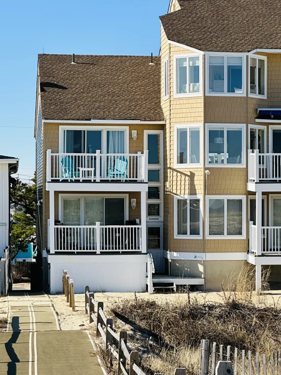 Second floor end deck ; 2 comfortable Adirondack chairs and more foldable zero G and bistro chairs as well to enjoy the ocean views and breeze