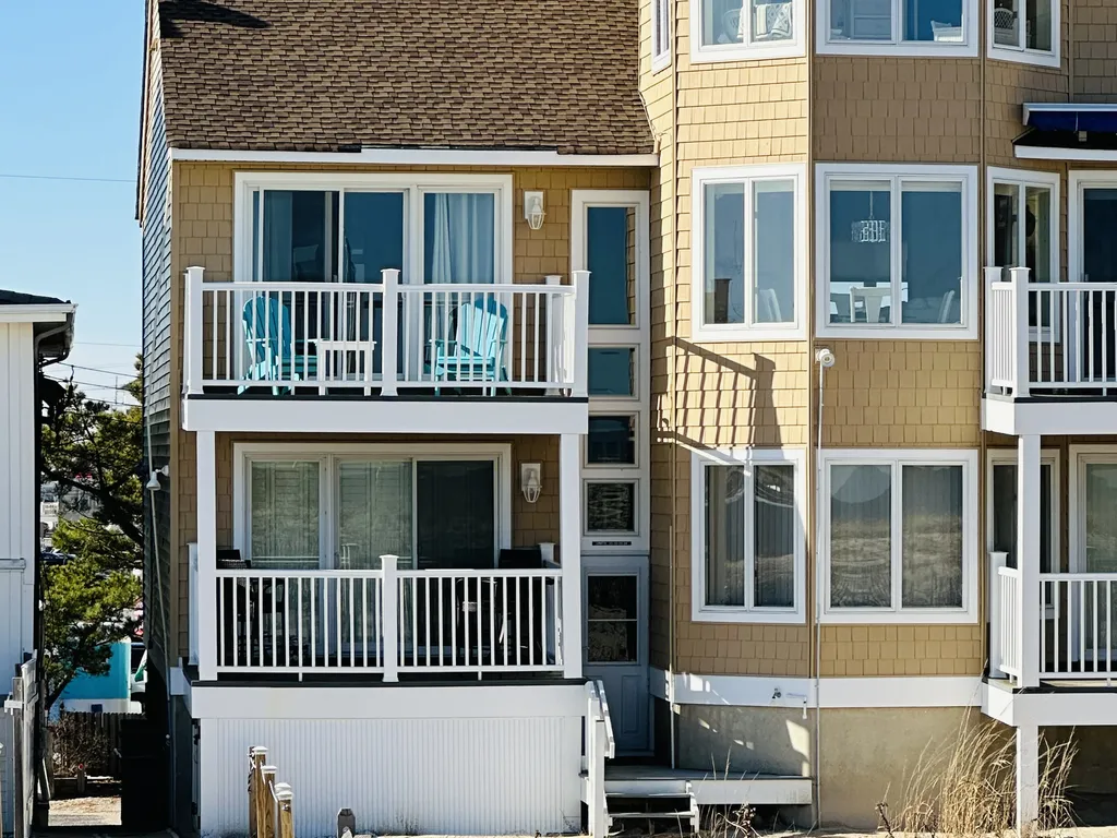 Second floor end deck ; 2 comfortable Adirondack chairs and more foldable zero G and bistro chairs as well to enjoy the ocean views and breeze