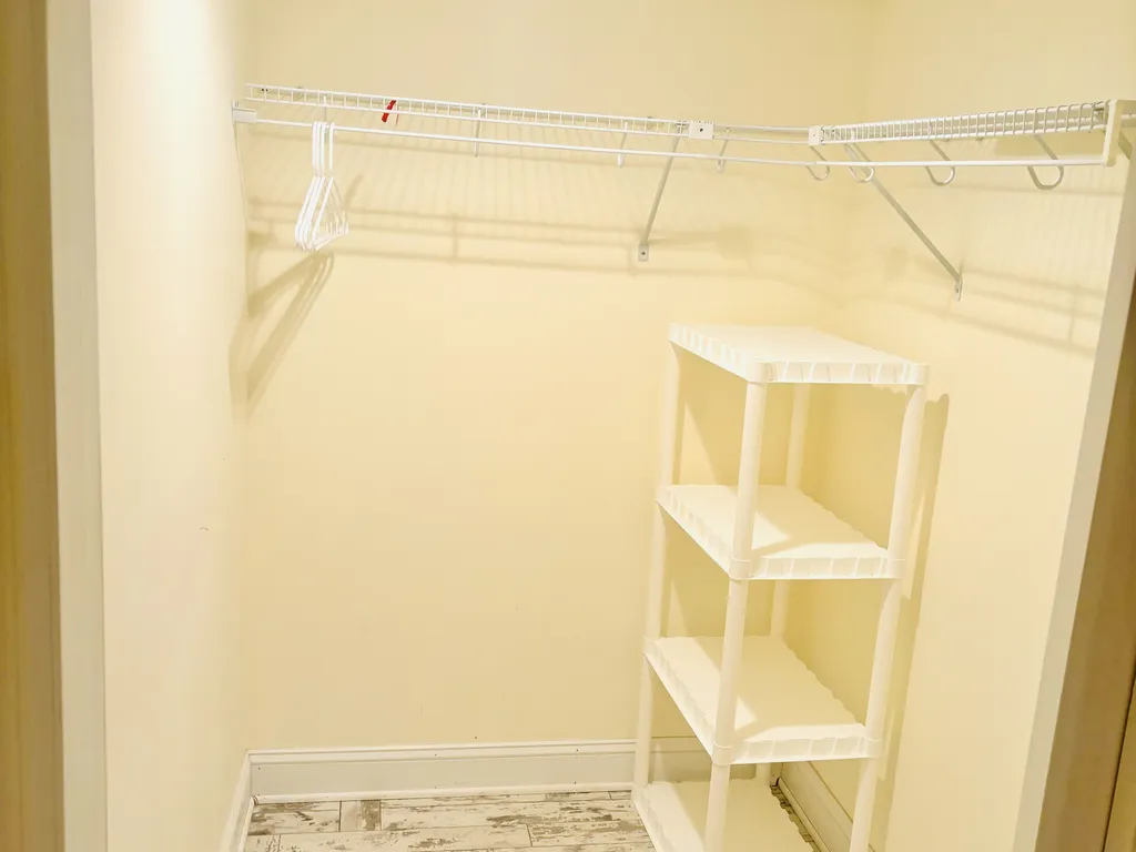 Large walk in closet in master bedroom 