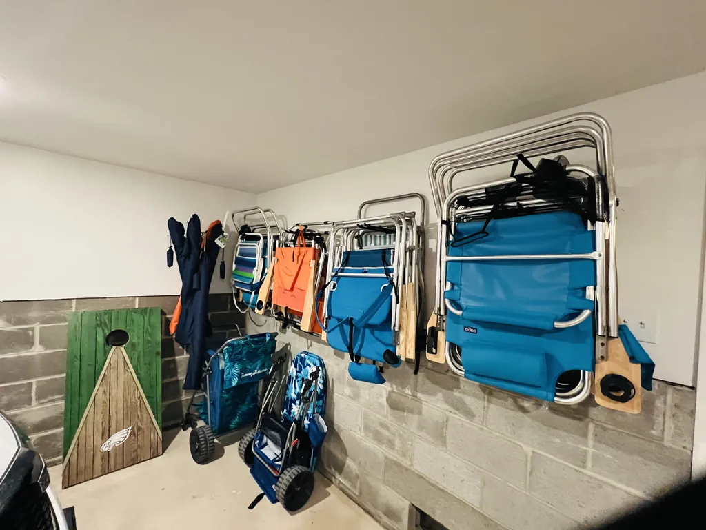 Tons of beach chairs, umbrellas and beach caddies
