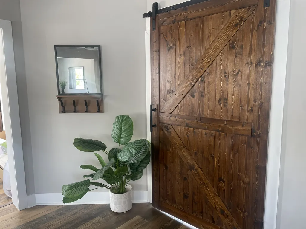 barn door to bedroom 1 from living room