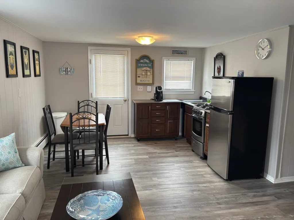Upstairs kitchen with door to upstairs and downstairs decks
