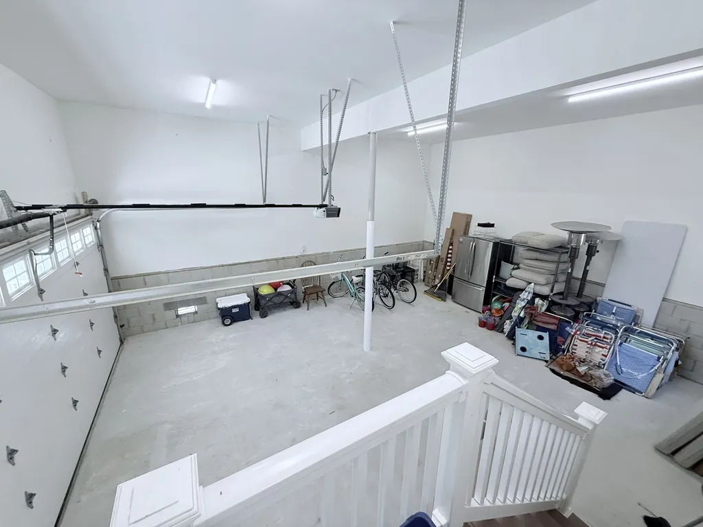 Large 2 car garage with refrigerator